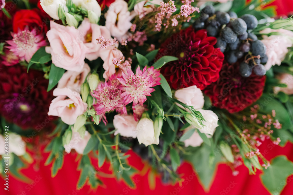 A flower background at a table of newlyweds A flower background at a table of newlyweds
