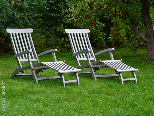 Relaxing comfortable classical lounge chairs in the garden