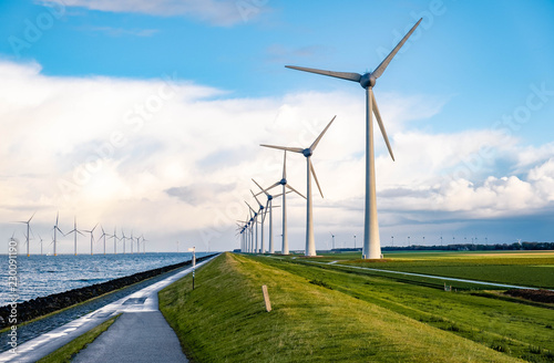 windmiil park in ocean, windmill farm rainy clouds photo