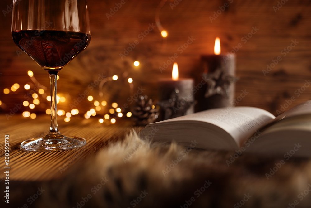 Naklejka premium Winter evening with wine and book
