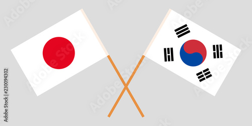 Crossed flags South Korea and Japan. Official colors. Correct proportion. Vector