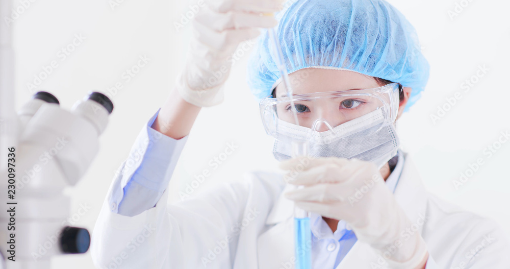 woman scientist take test tube woman scientist take test tube