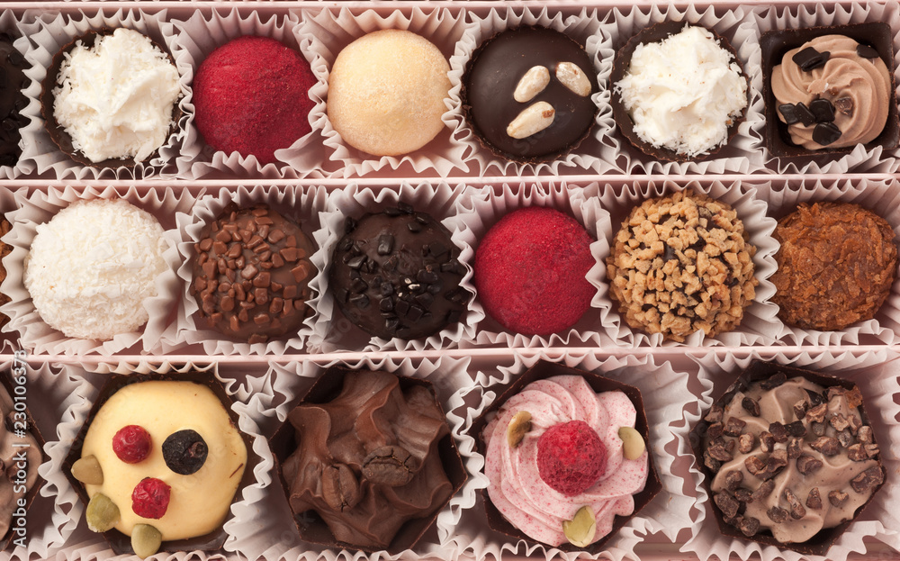 background of various chocolate candies background of various chocolate candies