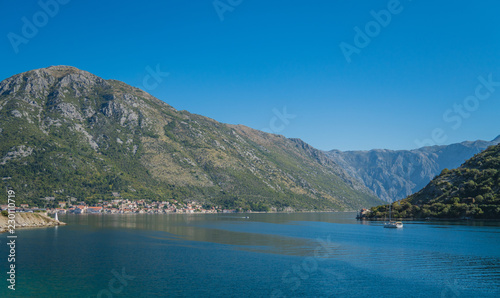 Mediterranean Landscape with Sailboat sailing in Bay of Kotor  Adriatic Sea  Montenegro