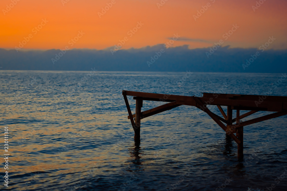 Fototapeta premium wooden pier at sunset