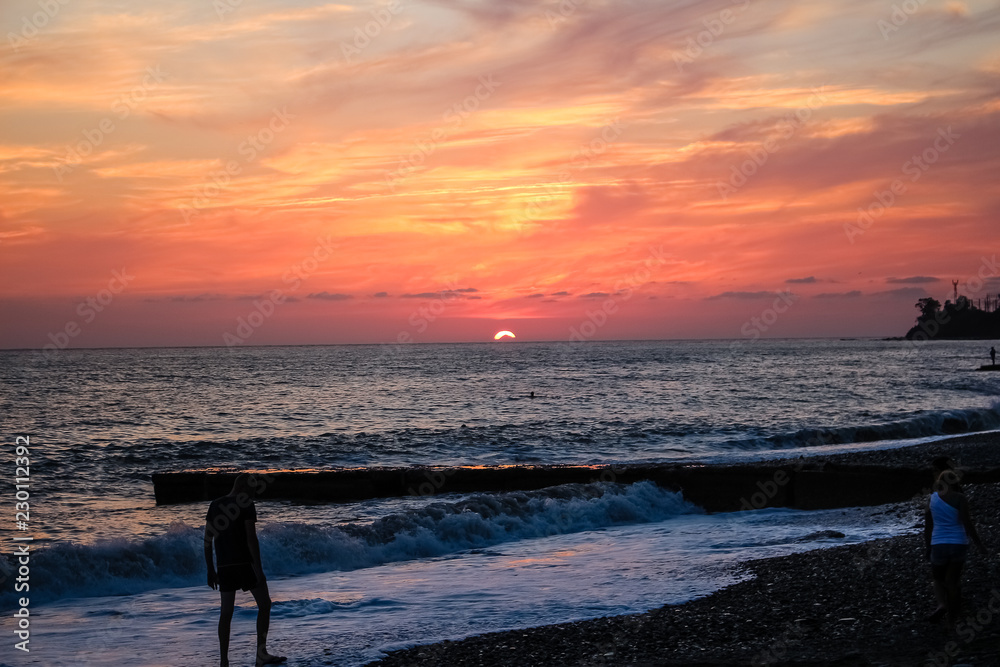Fototapeta premium fabulous red, burgundy sky. Sunset on the sea.