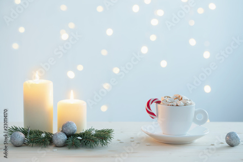 hot chocolate with marshmallow on blue  background