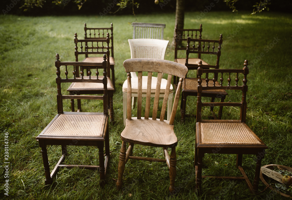 Fototapeta premium rows of old wooden chairs
