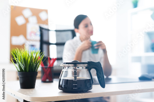 Vászonkép Photo with depth of field, highlighted focus on the coffee pot