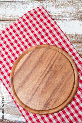 wooden board,red tablecloth on wooden table. Holiday, food concept. Mock up