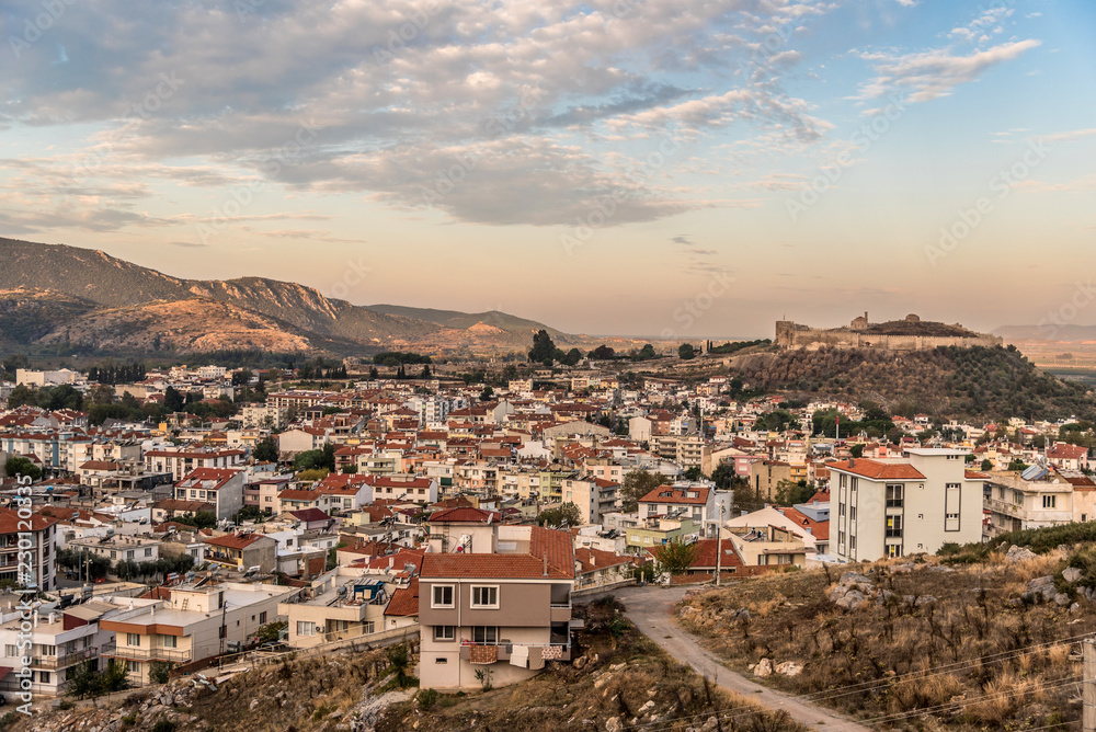 View of Selçuk with Ayasuluk fortress during sunrise in the morning, Turkey