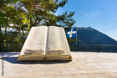 A monument of a marble book commemorating the Greek war of Independence in Zygovisti village of mountainous Arcadia in Peloponnese, Greece photo