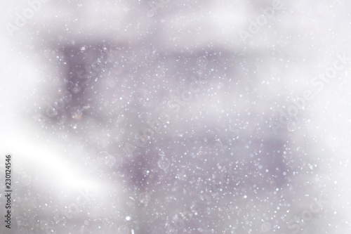 Snowfall texture of snowflakes on blurred background © kichigin19