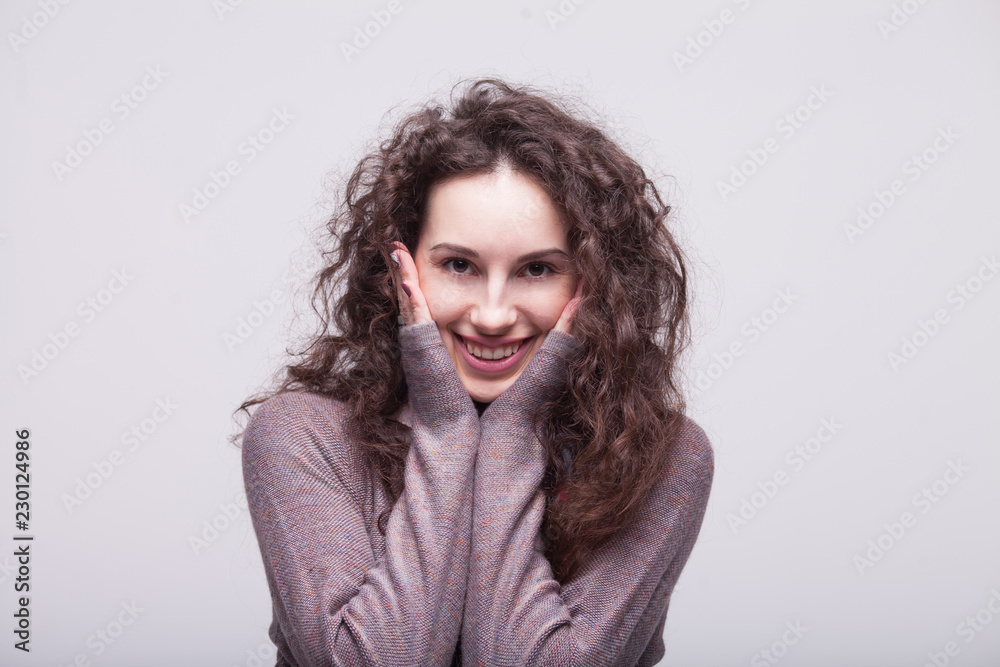 Glamour girl in dress on white. Woman with curly hair. Happy teacher. Warm dress. Smiling woman Glamour girl in dress on white. Woman with curly hair. Happy teacher. Warm dress. Smiling woman