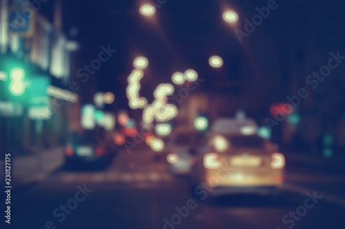 view of car in  traffic jam / rear view of the landscape from window in car, road with cars, lights and the legs of the cars  night view © kichigin19