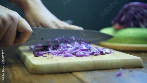 Shallot cut Shooting on the detail of the shallot cut. Cutting Shallots on Wooden Board. Slice the shallots.