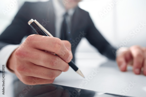 close up.businessman signing contract