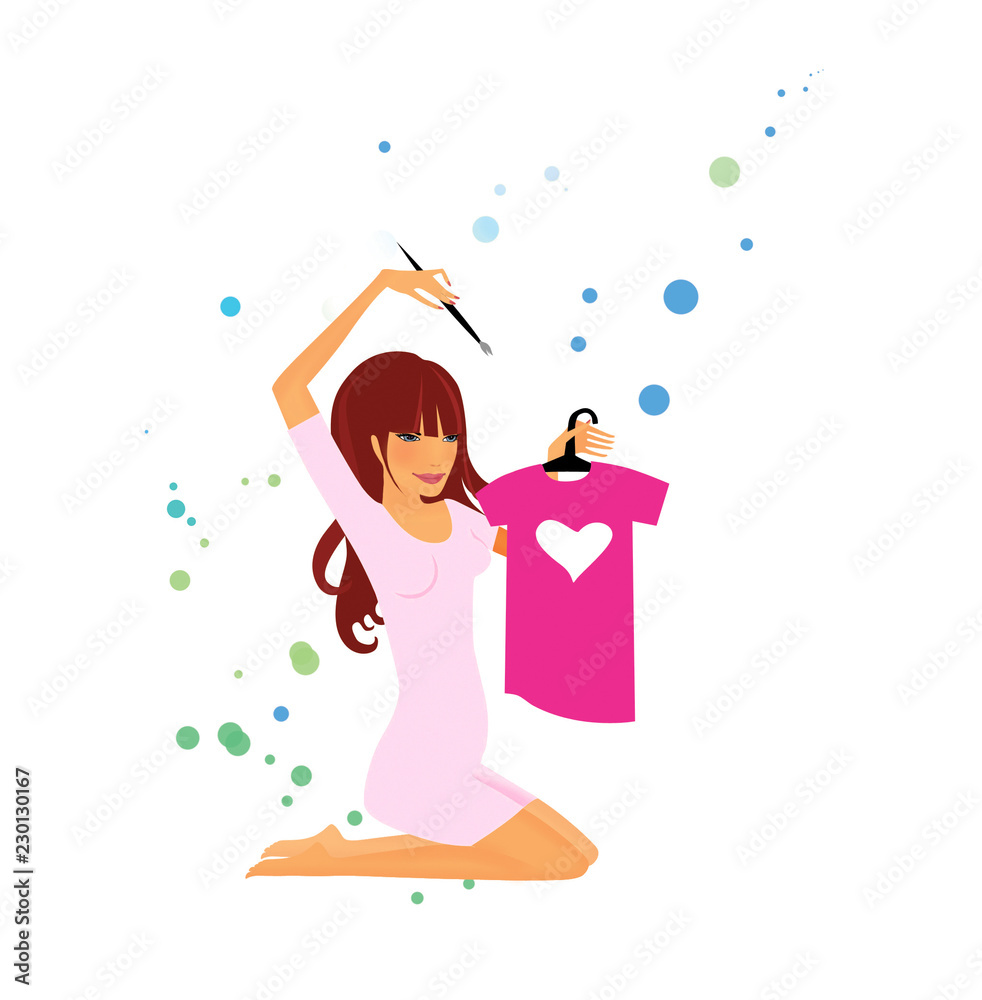 The girl is sitting on the floor on her knees. The girl draws on the children's t-shirt a white heart. Pregnancy.