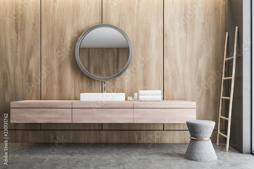 Sink and mirror in wooden bathroom