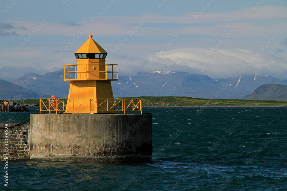 Yellow light house at the harbor of Reykjavik, Iceland