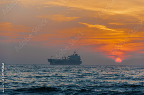  Cargo Ship At Beautiful sunset © Shmel