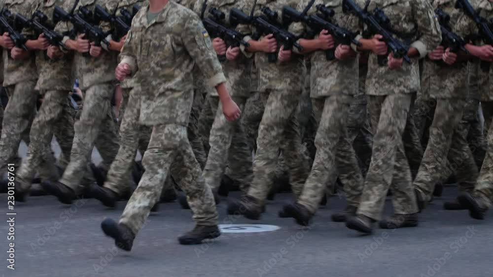 Military men marching in ranks at street Military men marching in ranks at street