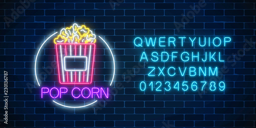 Neon glowing sign of pop corn in circle frame with alphabet. Fastfood light billboard symbol.