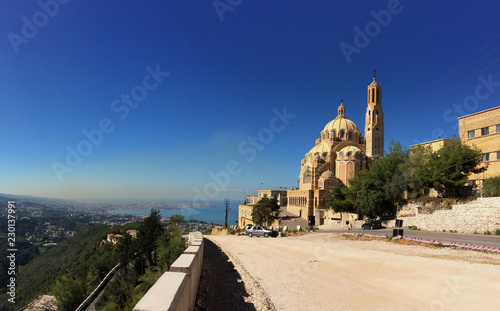 Saint paul cathedral in front of gorgious view on lebanese shore and beirut city from a distance photo