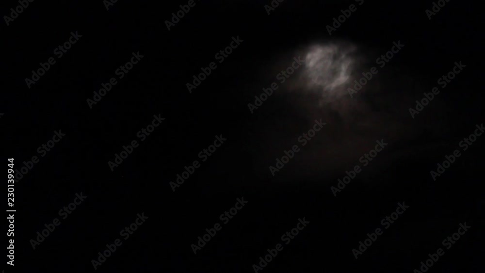 The full moon moves into the dark cloud. The full moon moves into the dark cloud.