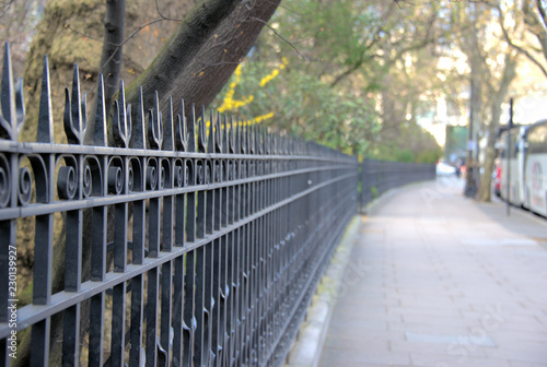 London england sidewalk with iron fence