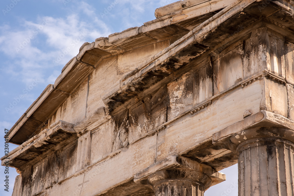 Close up of the top section of the Arch at the entrance to the Roman Forum in Athens, Greece.