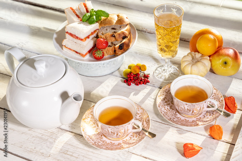 old school style tea at five afternoon service sandwich set cake sweet traditional table hotel cheesecake sugar pot china cup