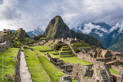 Long walkway into Machu Picchu above the ruins photo