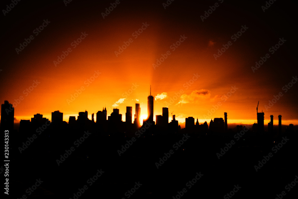 silhouette of city at sunset