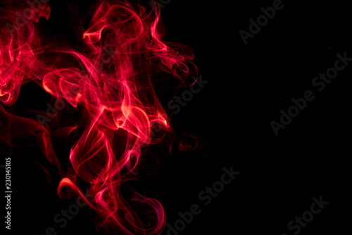 Red smoke on black background