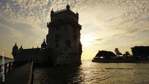 sunset at the tower of belem in lisbon photo