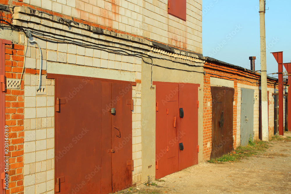 Brick garages for storing cars. Close-up. Brick garages for storing cars. Close-up.