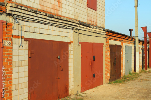 Brick garages for storing cars. Close-up.