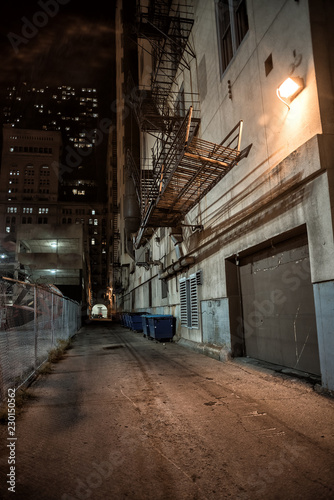 Dark and eerie downtown urban city alley at night © Bruno Passigatti