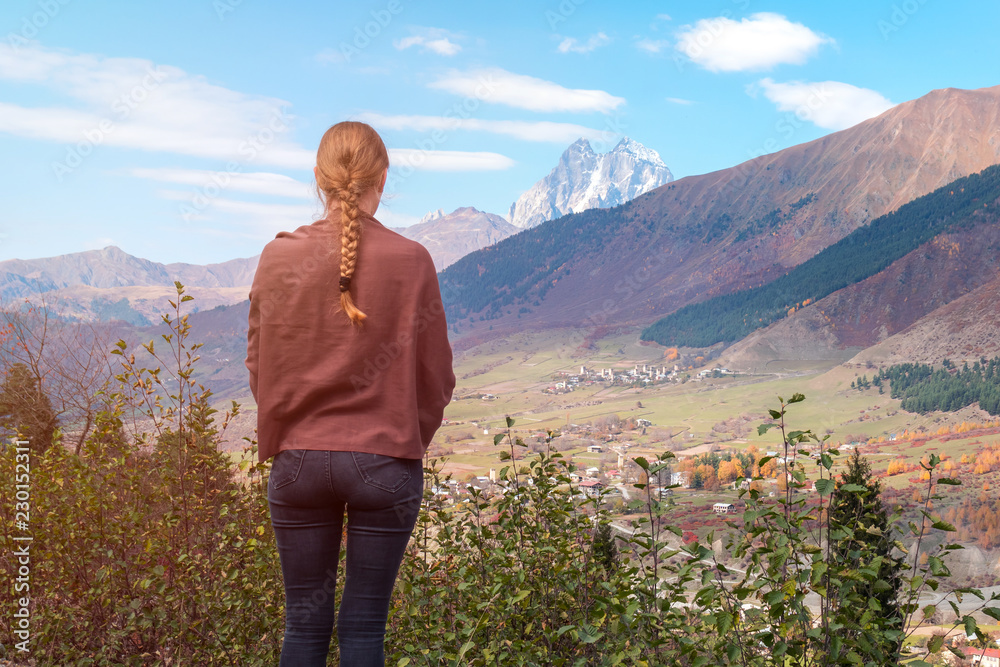 beautiful blonde girl on the background of Mount Ushba, mountains of Svaneti, Georgia beautiful blonde girl on the background of Mount Ushba, mountains of Svaneti, Georgia
