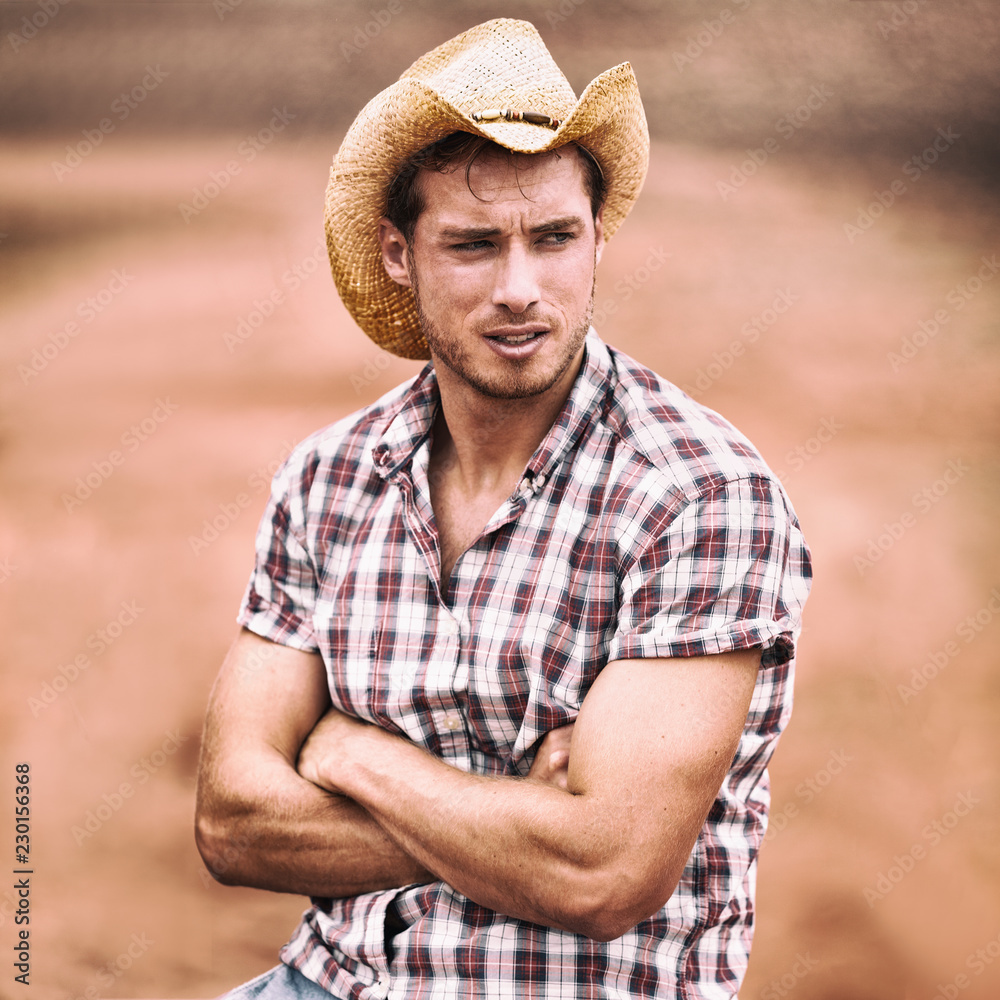 Cowboy hat sexy handsome american man in USA countryside farm. Farmer in  plaid shirt serious looking attractive. Stock Photo | Adobe Stock