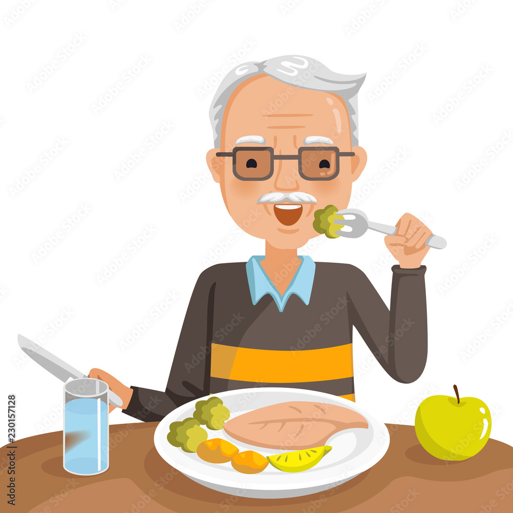 elderly man eating. He is sitting Eat fish steak on the table, apple