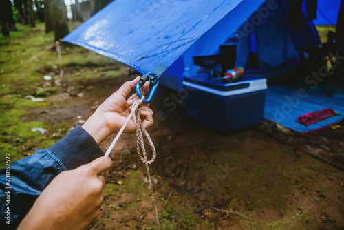 Travel nature relax in the holiday. camping on the moutainIn the wild nature. Pull the rope Carabiner.