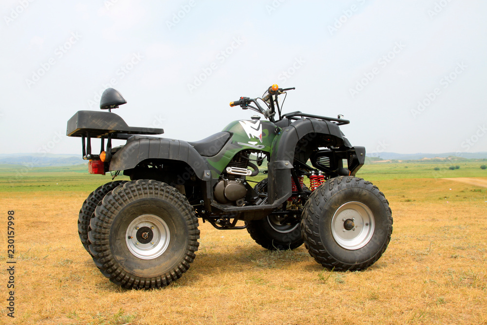 four wheels motorcycle on the grassland four wheels motorcycle on the grassland