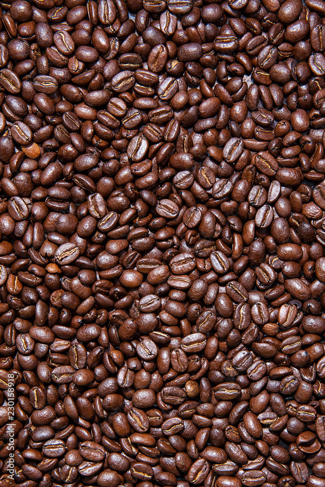 Vertical background of roasted Colombian coffee beans Vertical background of roasted Colombian coffee beans
