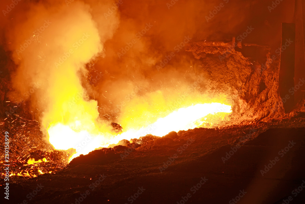 hot molten iron flowing from blast furnace hot molten iron flowing from blast furnace