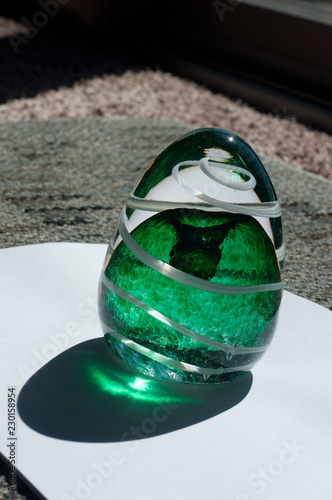 green with white spiral glass paperweight