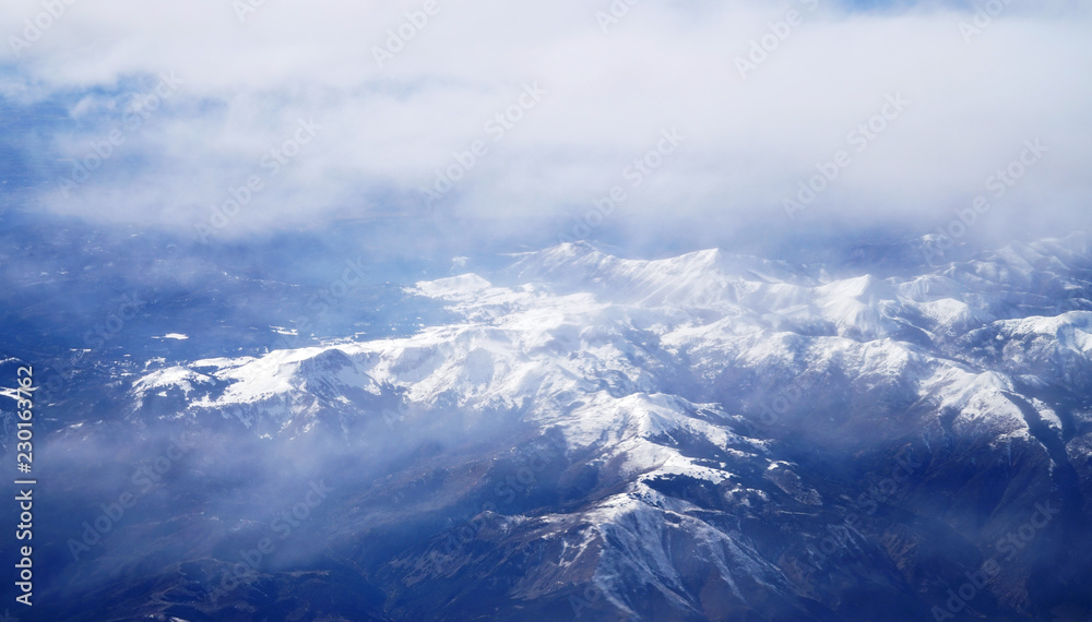 aerial view of snow mountains from airplane