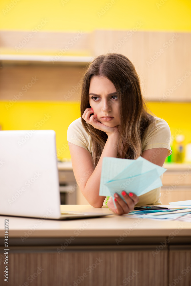 Young woman wife in budget planning concept