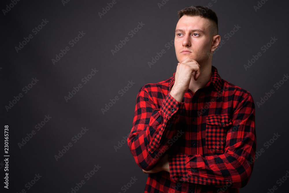 Serious young handsome man face thinking and planning Serious young handsome man face thinking and planning